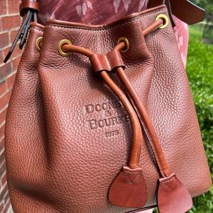 Beautiful Brown Dooney & Bourke drawstring bag. Good pre-owned condition.
